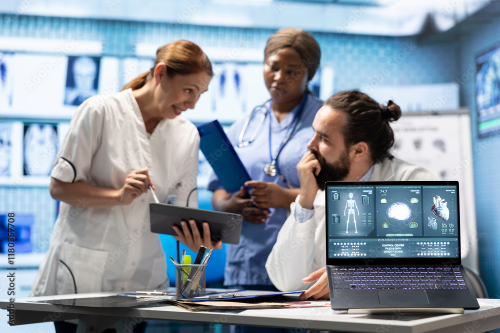 Fototapeta premium Doctors cardiologist analyze human anatomy scans to check heart condition in a treatment center. Team of licensed specialists working together to provide diagnostic and insurance services.