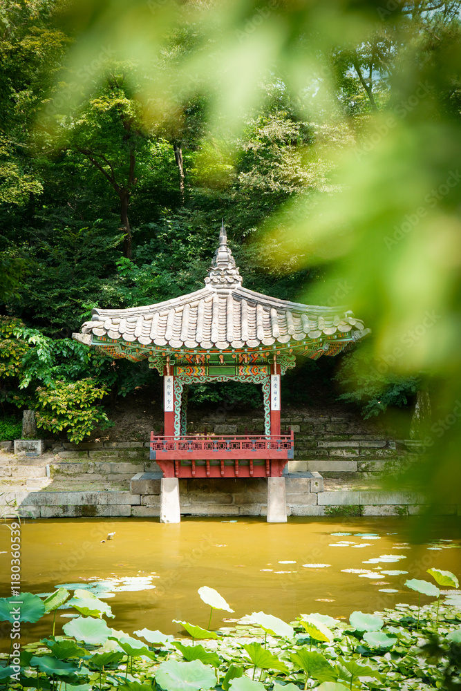 Traditional Korean pavilion in a serene natural setting, surrounded by lush greenery and a lily pond. Ideal for themes of architecture, culture, and nature. Traditional Korean pavilion in a serene natural setting, surrounded by lush greenery and a lily pond. Ideal for themes of architecture, culture, and nature.