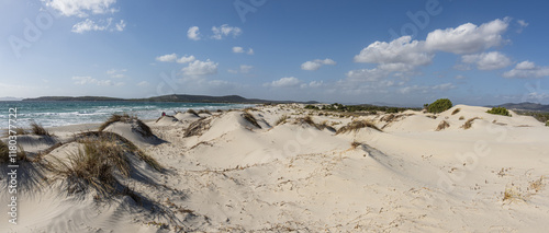 The beautiful beach of Is Solinas in Sardinia with its high white dunes on a windy day