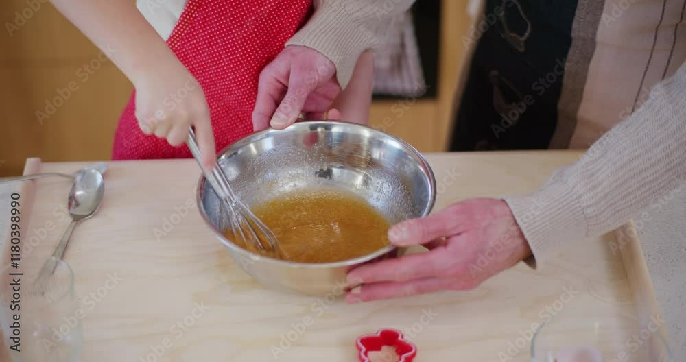 Young Boy Helps Dad Beat Eggs In Metal Bowl While Preparing Food Young Boy Helps Dad Beat Eggs In Metal Bowl While Preparing Food