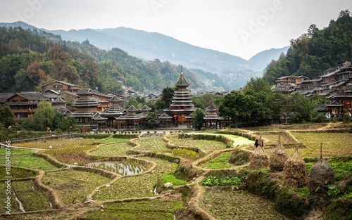 Zhaoxing Dong Ethnic village with a rice field at the entrance. China photo