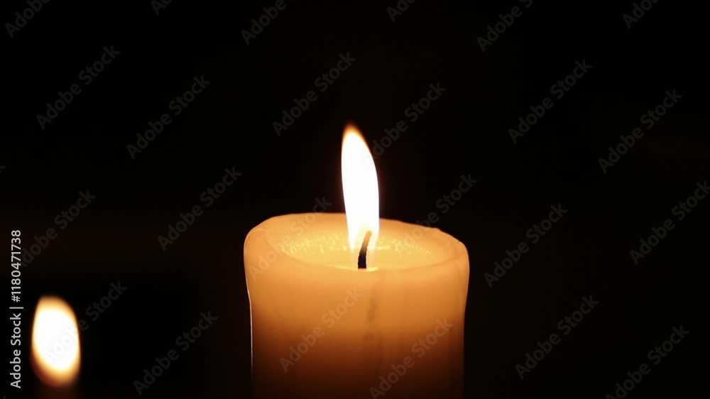 Closeup candle beautiful burning on dark black background with blur lights behind, candle fire flame light with empty space. Ritual with romantic candle wax fire
Closeup candle beautiful burning on dark black background with blur lights behind, candle fire flame light with empty space. Ritual with romantic candle wax fire