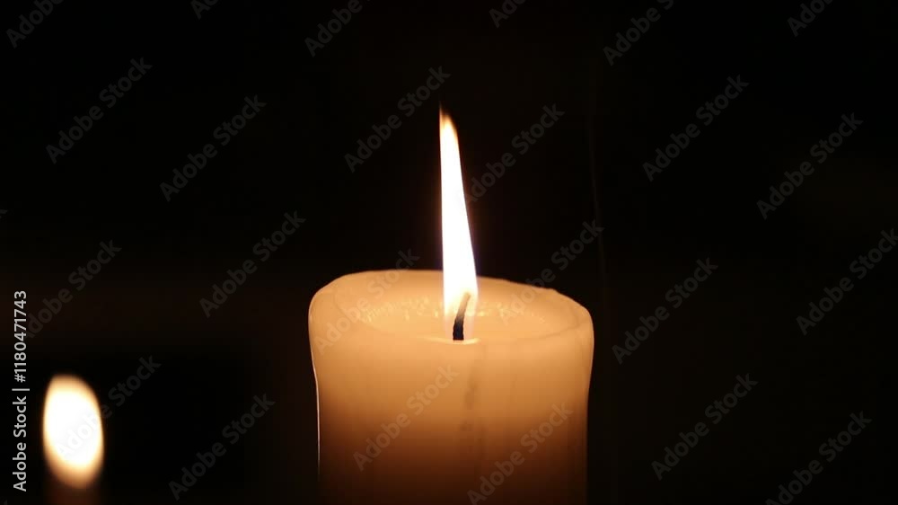 Closeup candle beautiful burning on dark black background with blur lights behind, candle fire flame light with empty space. Ritual with romantic candle wax fire
Closeup candle beautiful burning on dark black background with blur lights behind, candle fire flame light with empty space. Ritual with romantic candle wax fire