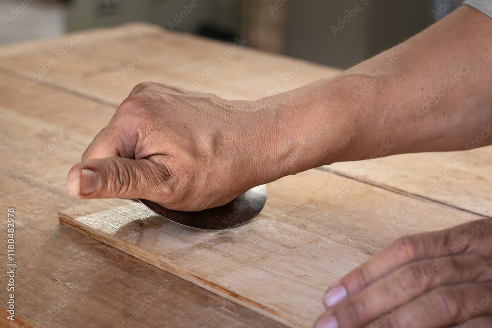 the carpenter works with manual equipment to polish wood the carpenter works with manual equipment to polish wood