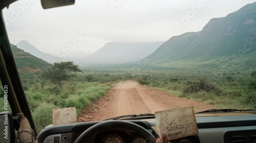 A scenic drive through lush green valleys, viewed from a vehicle's interior, invites exploration and a sense of endless possibilities. photo