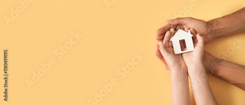 Hands of family with small ...