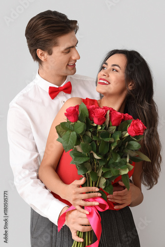 Young couple with roses on ...
