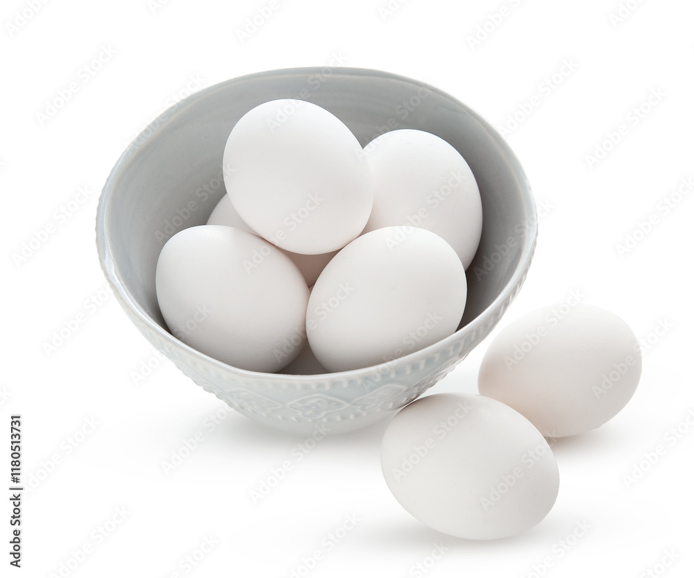Bowl and fresh chicken eggs isolated on white background Bowl and fresh chicken eggs isolated on white background