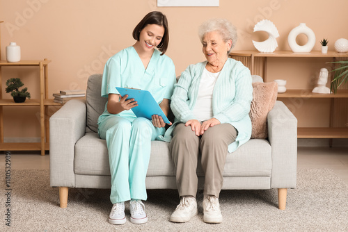 Smiling nurse in scrubs dis...