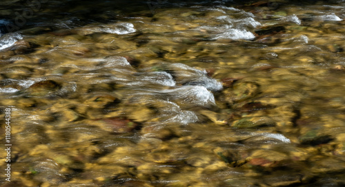 Small Rapids In The Shallow Waters Of Quartz Creek In Glacier photo