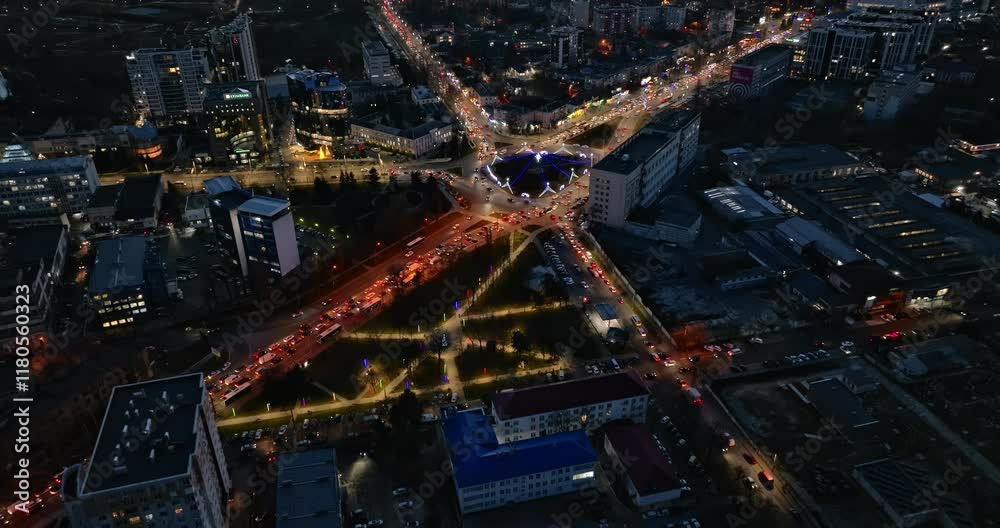 Aerial drone view of cars in traffic at a roundabout in Chisinau, Moldova at sunset Aerial drone view of cars in traffic at a roundabout in Chisinau, Moldova at sunset