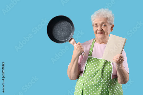 Senior woman in apron with ...