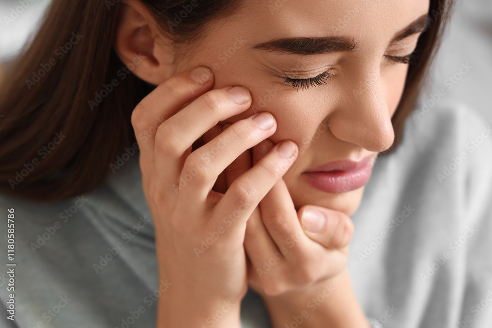 Young woman suffering from toothache at home, closeup Young woman suffering from toothache at home, closeup