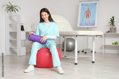 Female physiotherapist with...