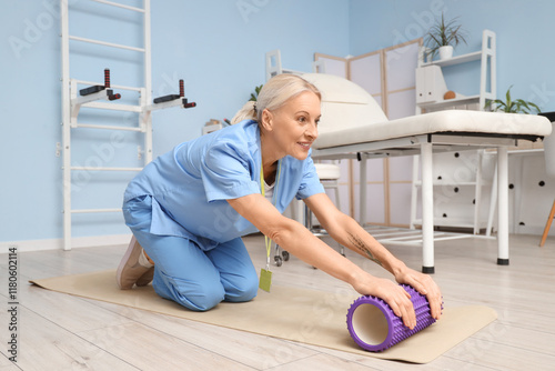 Female physiotherapist with...