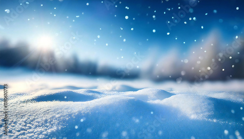 ボケ感のある雪景色の背景。青空の下雪の降る雪山イメージ。スキー場のゲレンデ背景。A background of snowy scenery with a blurred effect. Image of a snowy mountain under a blue sky. A background of a ski slope. photo