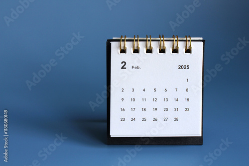 Monthly calendar template for the new year 2025 desk calendar,isolated on Blue background. photo