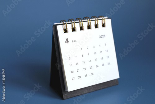 Monthly calendar template for the new year 2025 desk calendar,isolated on Blue background. photo