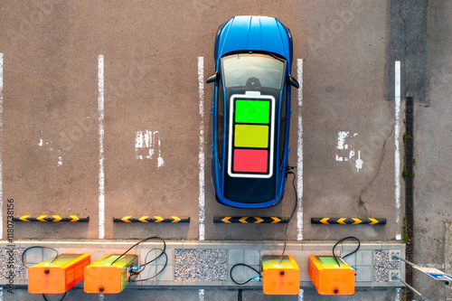 Modern electric auto replenishes battery in standard mode at public charging station. Cell image shows process. Solution for drivers dealing with short distances photo