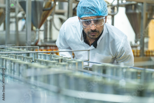 Technician performing detailed quality checks on a manufacturing line, highlighting industrial innovation, efficiency, and a commitment to high production standards. photo