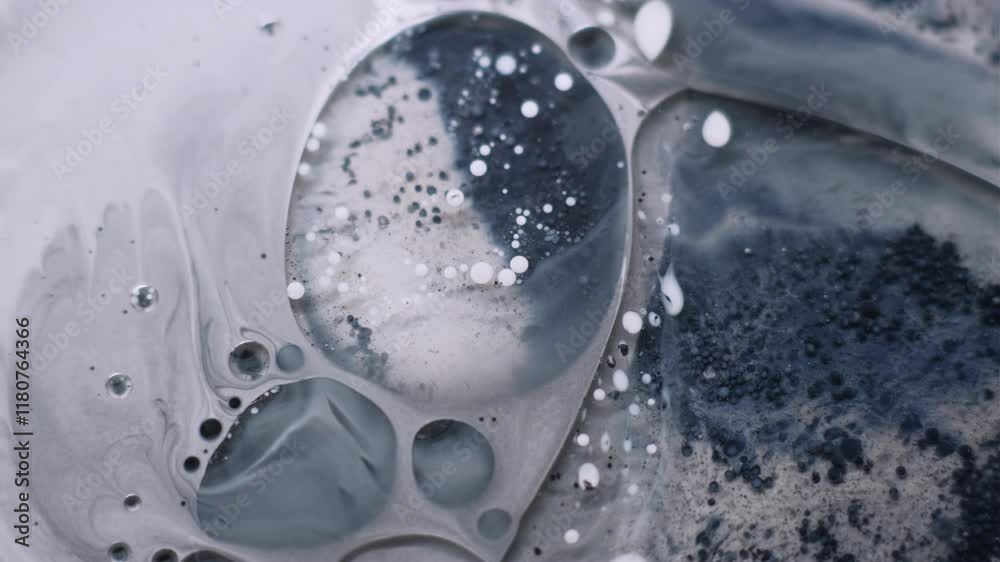 Acrylic blob. Bubble emulsion. Pigment particles floating in grunge water. Gray black ink drop bursting mix blur abstract background.