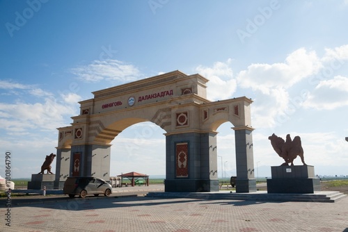 Entrance arch to Dalanzadgad, Mongolia under blue sky. photo