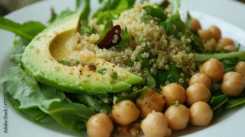 Healthy Green Meal for Lunch - A healthy lunch featuring a green salad with avocado, chickpeas, quinoa, and a tangy vinaigrette dressing for a nourishing midday meal