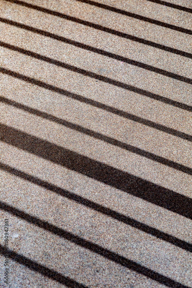 striped shadow at a grey background floor in different measures in harmony striped shadow at a grey background floor in different measures in harmony