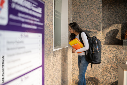 indian girl filling admission form or inquiring 