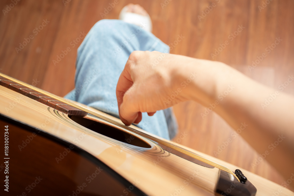 Hand Playing Acoustic Guitar Close-Up, person teaching instrument and musical skill, guitarist practicing skill for performance Hand Playing Acoustic Guitar Close-Up, person teaching instrument and musical skill, guitarist practicing skill for performance