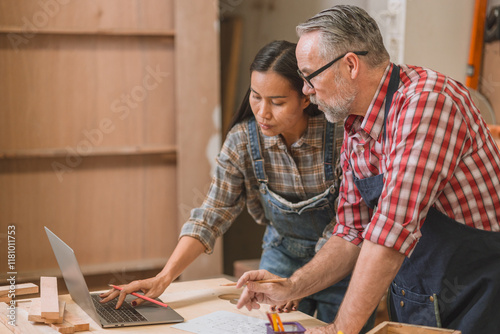 Bild auf Leinwand Professional carpenter man working with wood piece design furniture in workshop