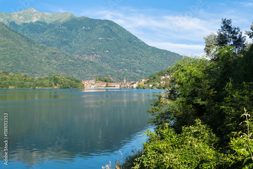 Charming Italian bathing lake among the mountains. Lake Mergozzo with in the background the town of Mergozzo, valle Ossola. Province of Verbano Cusio Ossola in Piedmont region, Italy photo