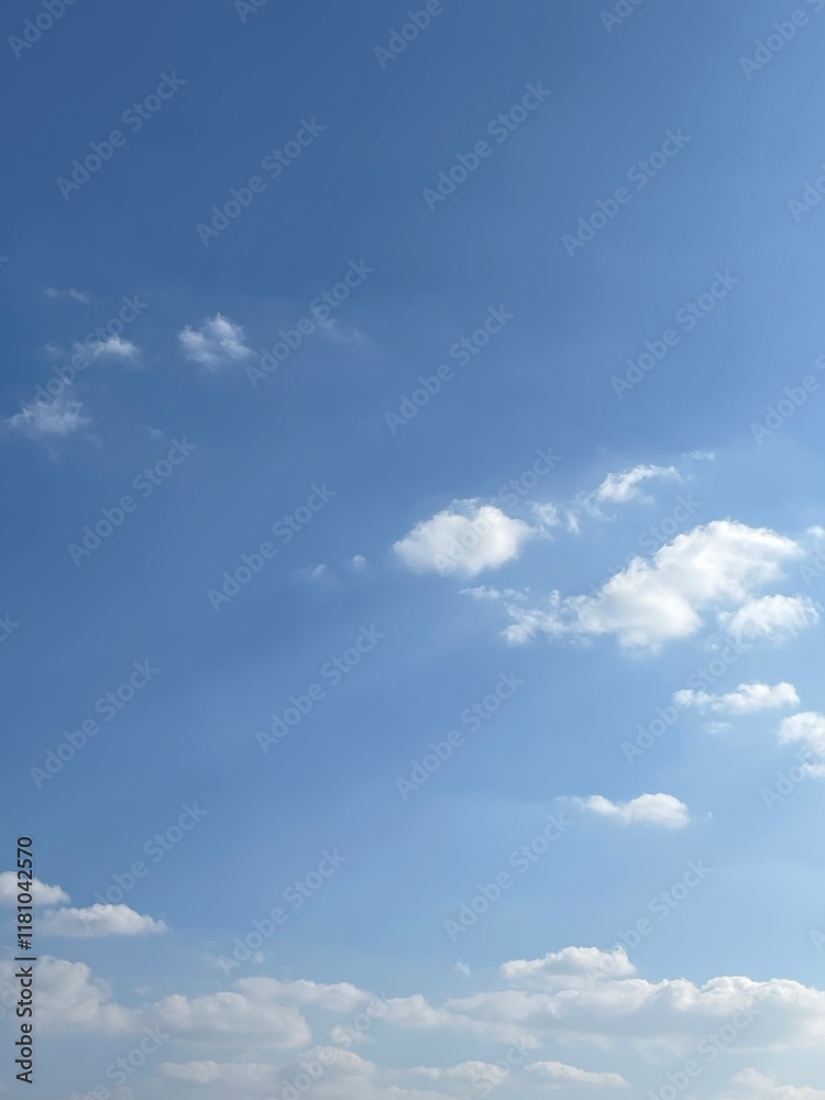 Obraz premium Serene Sky with Fluffy Clouds