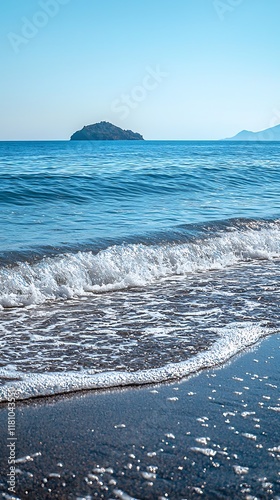 Serene ocean with calm waves and distant island