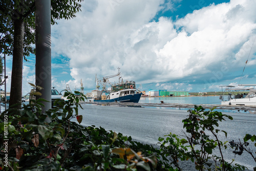 Obraz na płótnie Single fishing ship is resting at a pier in Pula city harbor, peaceful sea and low traffic around w salonie