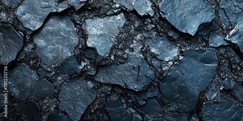 Close-up of cracked asphalt with detailed texture