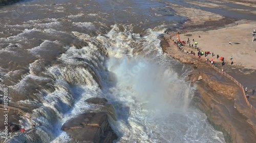 Hukou Waterfall in Shanxi Province, China, is a magnificent sight of the surging Yellow River water, filled with energy and awe inspiring，A fast flowing river