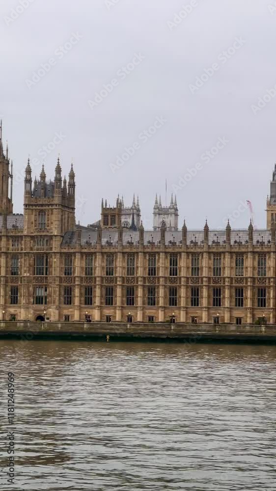 Big Ben and Houses of Parliament stand majestically by the River Thames, framed by Westminster Bridge, slow motion Big Ben and Houses of Parliament stand majestically by the River Thames, framed by Westminster Bridge, slow motion