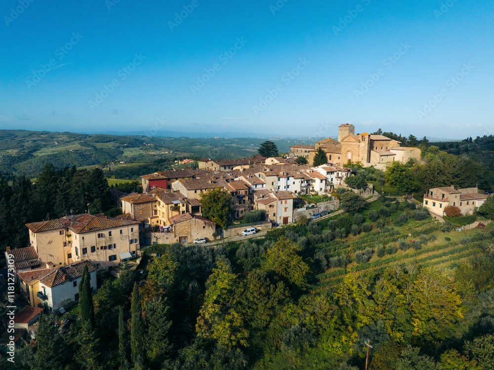 Aerial view of beautiful medieval village surrounded by rolling hills and vineyards, Greve in Chianti, Italy. Aerial view of beautiful medieval village surrounded by rolling hills and vineyards, Greve in Chianti, Italy.