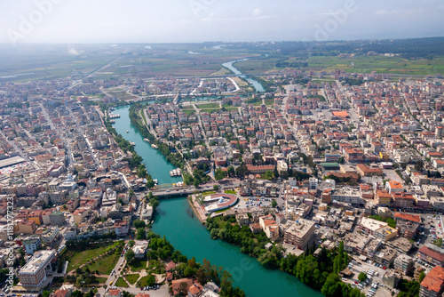 Aerial view of vibrant cityscape with Manavgat River and bustling bridge, Manavgat, Turkey. photo