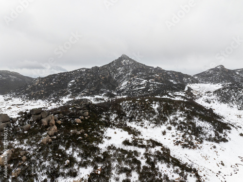 Aerial view of snowy Mount Buffalo with rugged terrain and beautiful landscape, Mount Buffalo, Victoria, Australia. photo