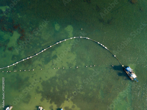 Aerial view of fishing and marine port with tranquil waters and green coastline, Byala, Bulgaria. photo