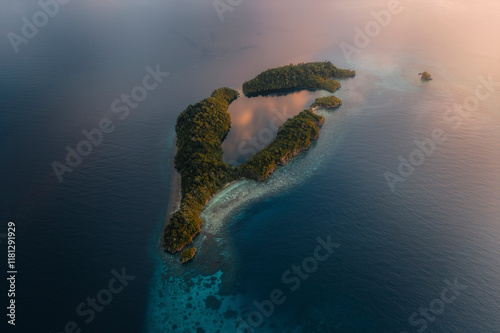 Aerial view of beautiful Kididiri Resort on a tropical island with serene coastline and blue ocean, Tojo Una Una Regency, Indonesia. photo