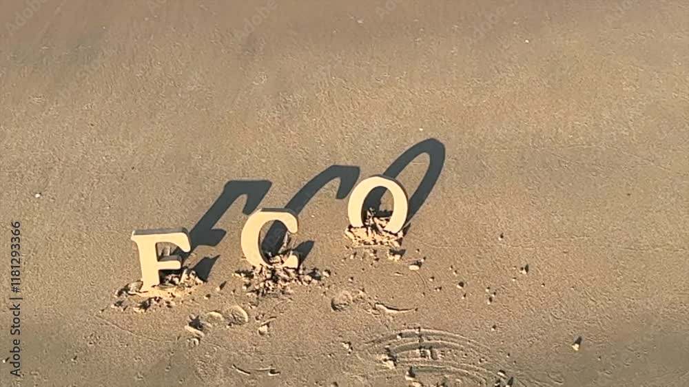 Eco message on sandy beach highlights environmental sustainability, eco letters reflecting on ocean beauty, inspiring mindful care for environmental preservation and ocean ecosystem