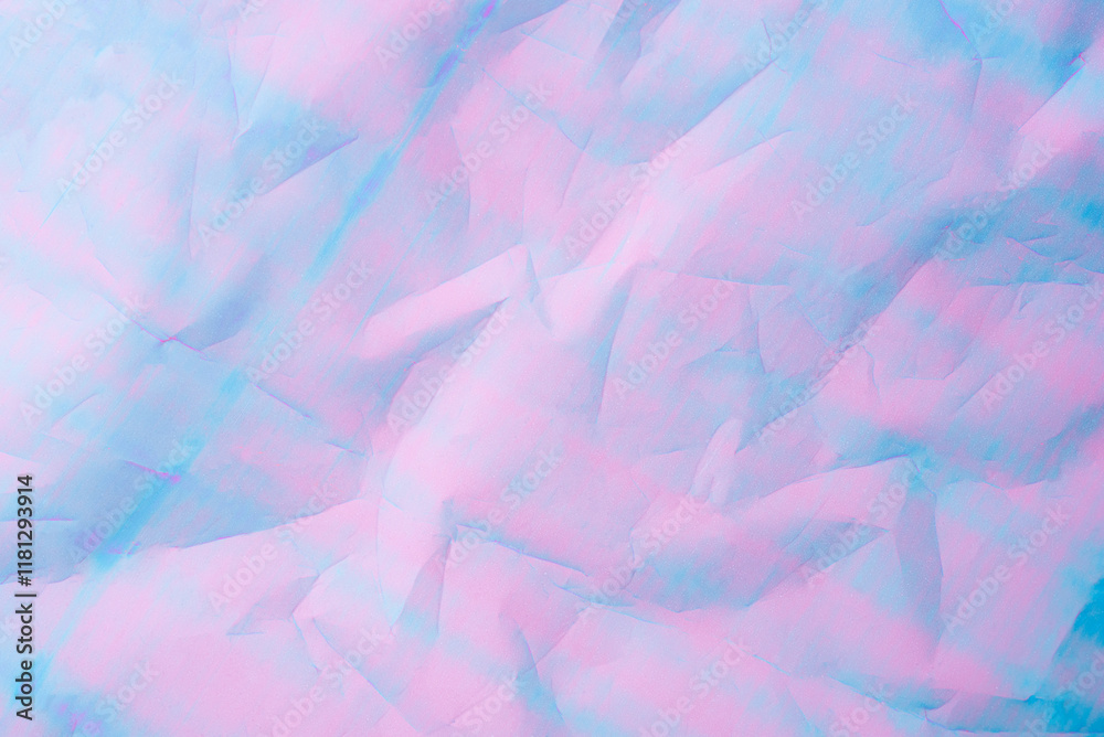 Fototapeta premium An abstract background featuring pastel hues of pink and blue with a textured crumpled paper effect.