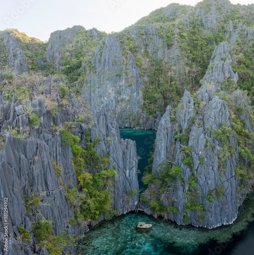 Aerial view of twin lagoon surrounded by limestone cliffs and turquoise water, Banuang Daan, Coron, Palawan, Philippines. photo