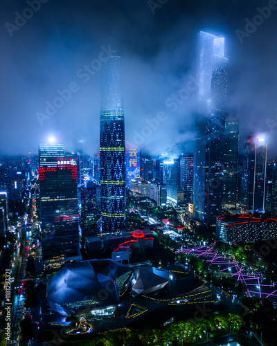 Aerial view of vibrant night skyline with illuminated skyscrapers and modern architecture, Guangzhou, China. photo