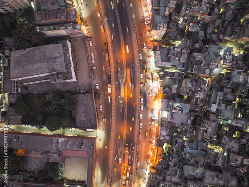 Aerial view of bustling Paharganj cityscape with vibrant lights and busy streets, New Delhi, India.
