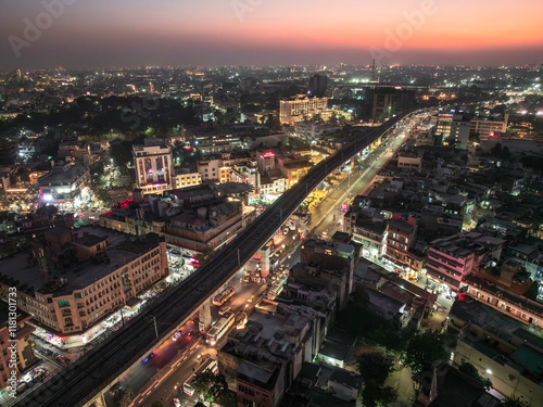 Wallpaper Mural Aerial view of bustling cityscape with illuminated buildings and busy highway at night, Sindhi Camp, Jaipur, India. Torontodigital.ca