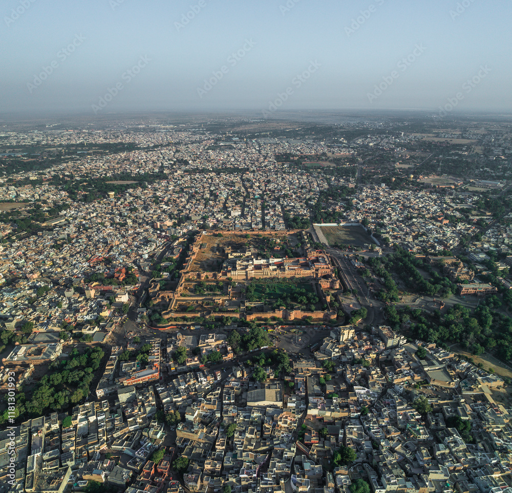 Aerial view of junagarh fort surrounded by a beautiful cityscape with dense rooftops, Bikaner, India. Aerial view of junagarh fort surrounded by a beautiful cityscape with dense rooftops, Bikaner, India.